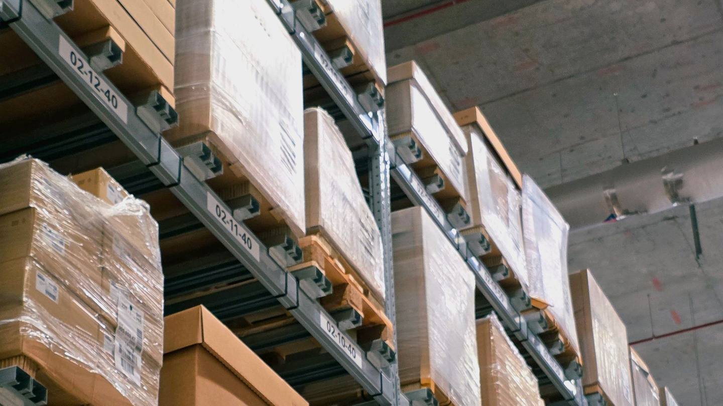 Warehouse shelves stacked with parcels